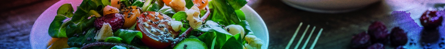 two scrumptious salads on a farm-style table