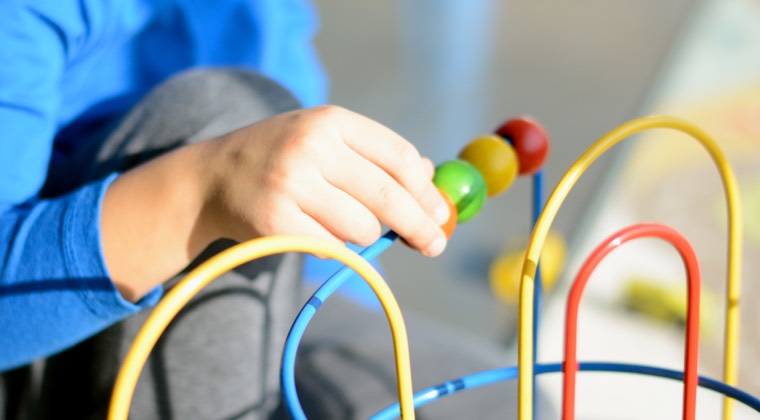 a woman using a occupational therapy device