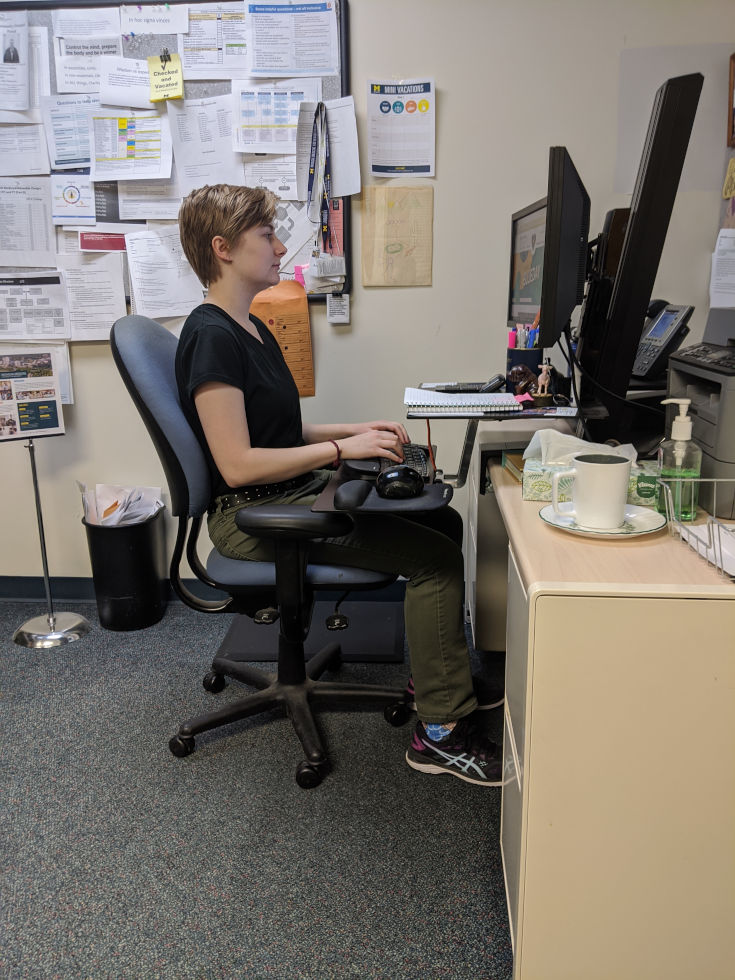 female sitting at desk